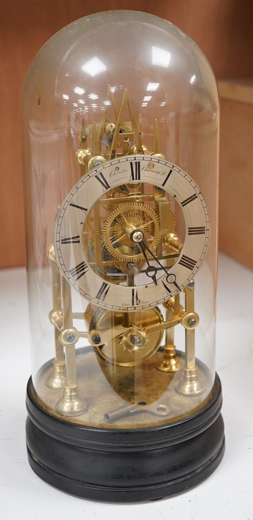 A Victorian skeleton clock under dome, 30cm
